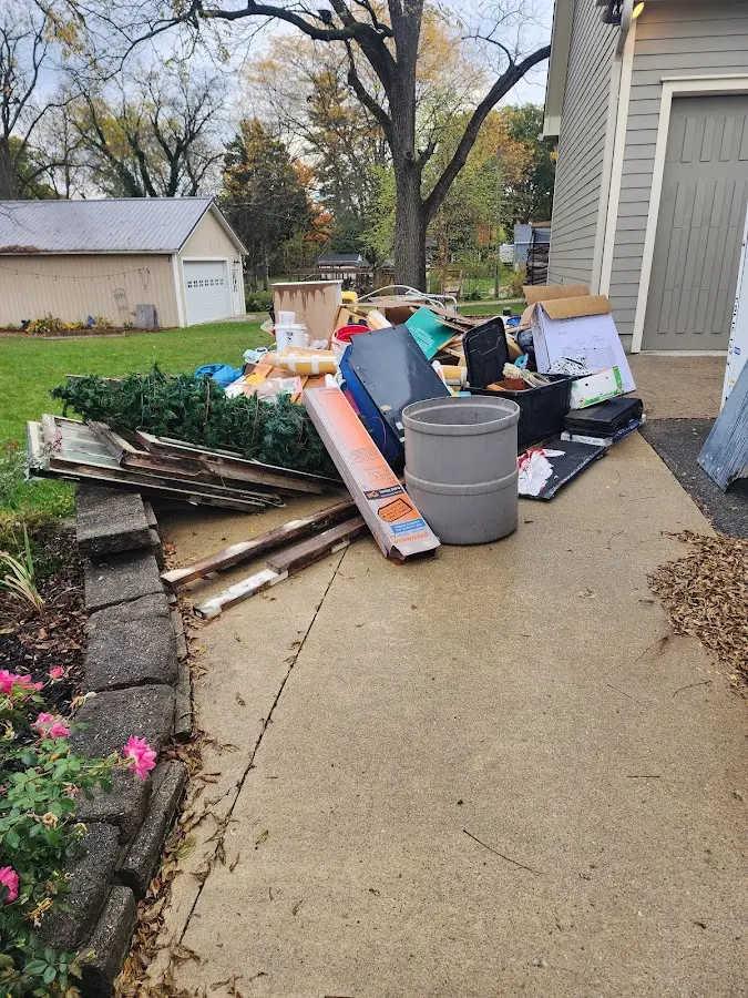 Dumpster being loaded with debris for Estate Cleanout Dumpster Rental in Upland